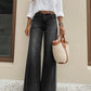 High-Waist-Jeans mit weitem Bein und Knopfdetail