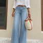 High-Waist-Jeans mit weitem Bein und Knopfdetail
